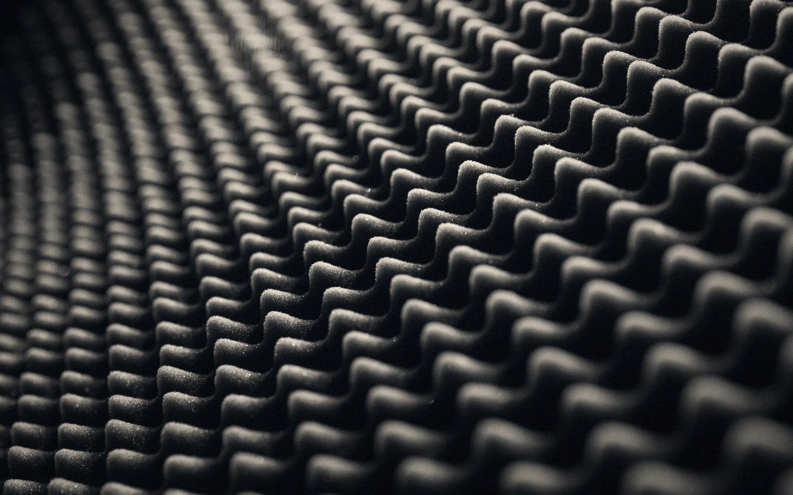 Acoustic panels being fixed to a wall