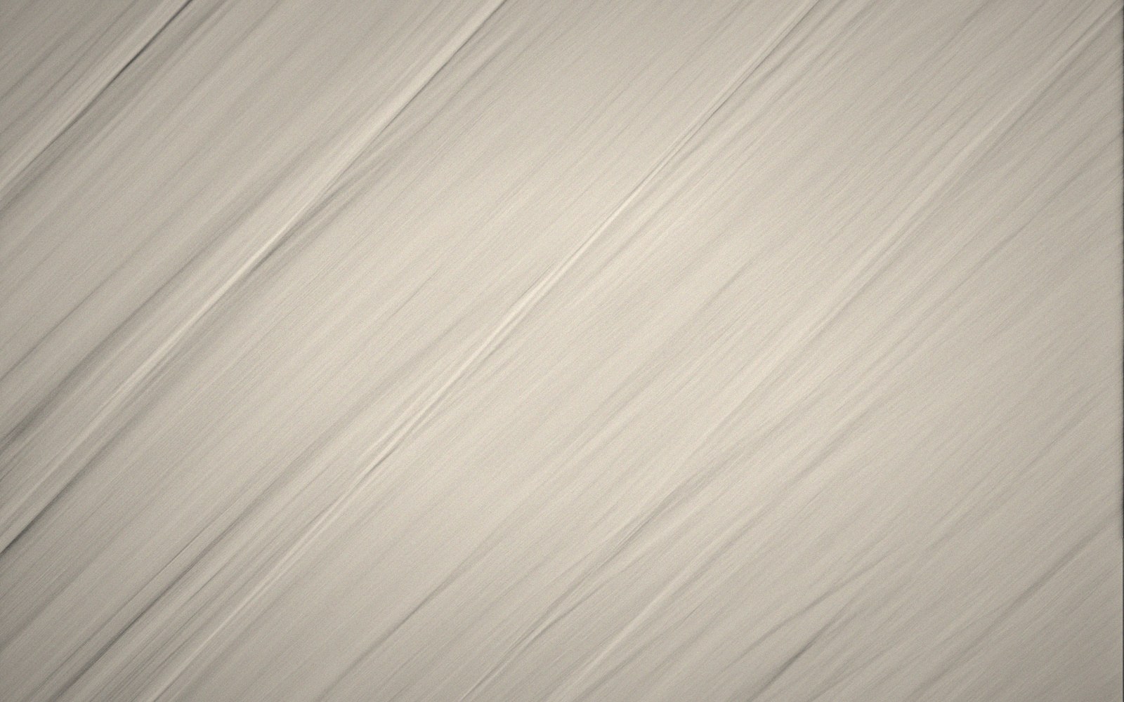 Close-up of diagonal streaked lines forming a subtle grayscale textured pattern